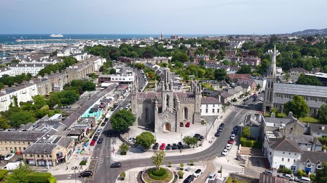 Dun Laoghaire Dublin, aerial birds eye Monkstown Church historical landmark and seaside, sunny.