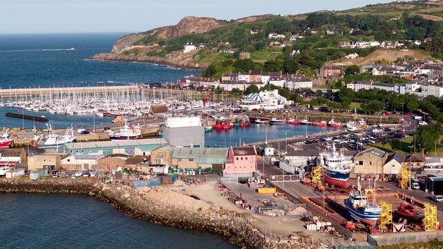 Drone scenic dolly of Howth Shipyard and industrial marina, Dublin, Ireland