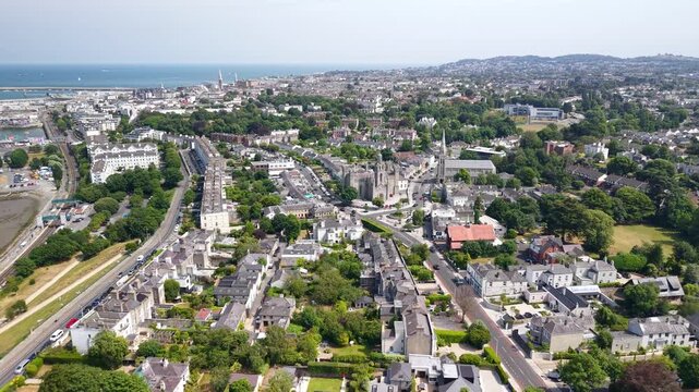 Dun Laoghaire drone cityscape with Monkstown and coastal promenade. Sunny day in Dublin