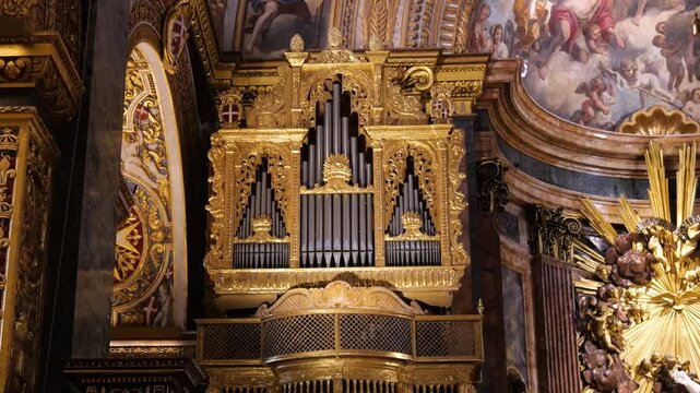 gilded pipe organ st john's co cathedral valletta altar sculptures frescoed arches sacred music baroque artistry malta Girolamo Cassar architecture internationally recognized heritage site 16th