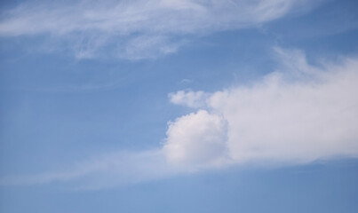 Obraz premium Unique Round Cumulus Cloud Ball in Bright Blue Sky 