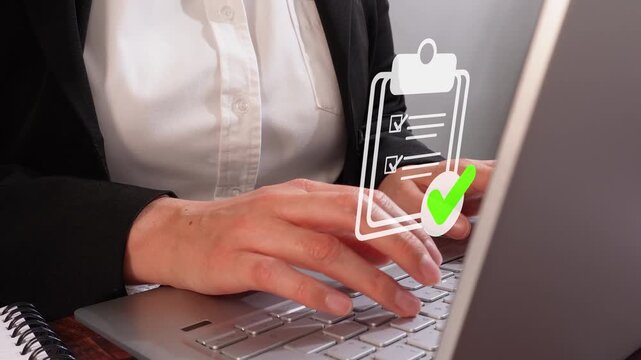 Close-up of a woman's hands typing on a laptop, featuring an animation of a clipboard icon and a checkmark