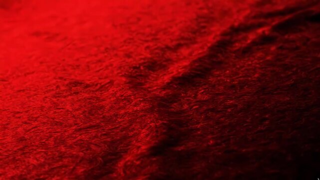 Abstract red textured background with soft lighting and subtle ripples