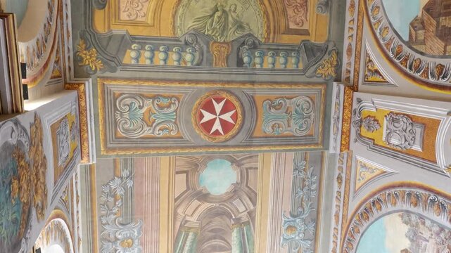painted ceiling fresco detail grand master's palace valletta maltese cross medallion gilded frieze border scrollwork ornament baroque ceiling art painted architecture knights of malta symbol