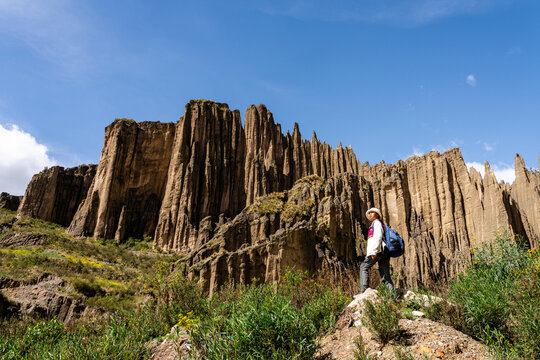 Young asian woman exploring the Valle de las Animas rock formations near La Paz, Bolivia