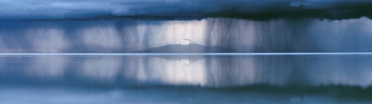 Panorama of a storm over the Salar de Uyuni, Bolivia
