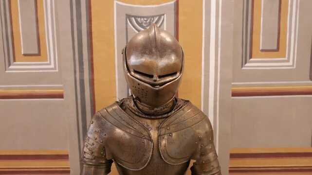 close helm armor bust palace armoury grand master's palace valletta pointed visor steel helmet striped wall panel backdrop knight's armor display knights of malta armoury collection malta