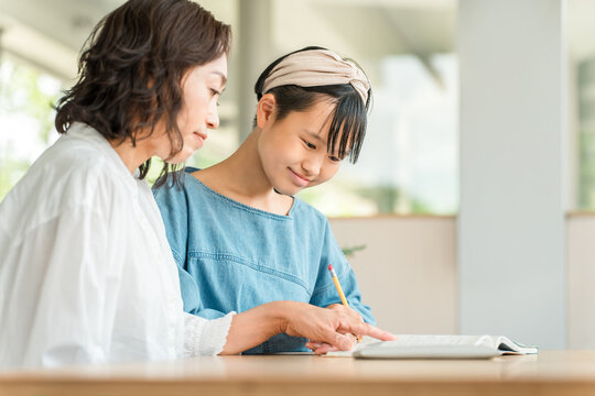 A middle school girl who gets tutoring from her mother, teacher, private tutor, and cram school instructor.
