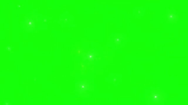 Particles float gently against a vibrant green screen background to provide a versatile element for digital compositing projects.