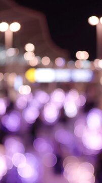 A Captivating Night Scene with Glowing Lights and Ambiance, Featuring Bokeh Effects and Vibrant Purple Hues in a Softly Blurred Background