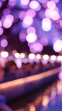 Enchanting Display of Soft Purple Bokeh Lights Reflecting on Water, Creating a Dreamy Atmosphere of Serenity and Magic at Nighttime