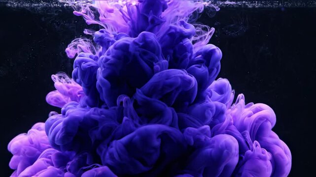 vibrant purple and blue ink clouds swirling and dissolving in dark water, abstract fluid motion, dynamic shapes and patterns, mesmerizing explosion