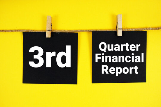 3rd Quarter Financial Report paper notes hanging on the rope with clothespins