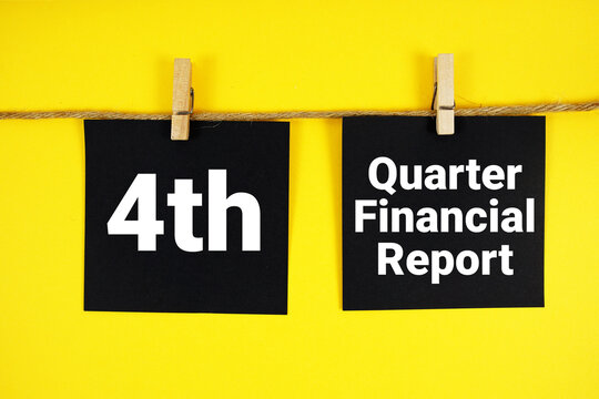4th Quarter Financial Report paper notes hanging on the rope with clothespins