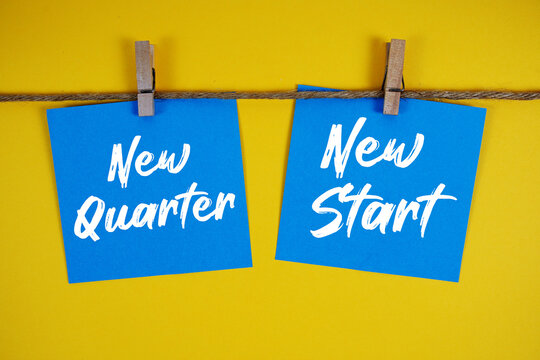 New Quarter New Start paper notes hanging on the rope with clothespins