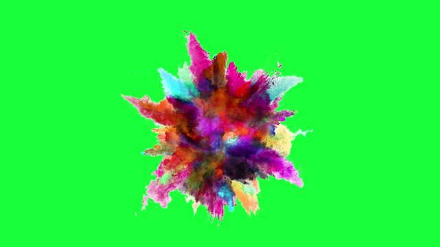 Vibrant explosion of colorful powder isolated on a bright green background