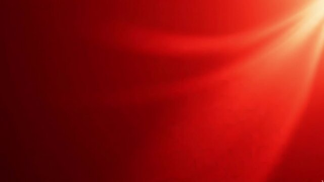 Abstract red background with soft light rays and gradient texture