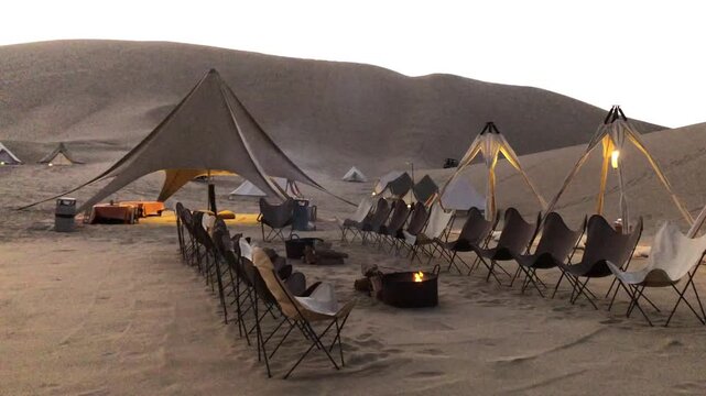 Exclusive glamping event with campfire in the ica desert