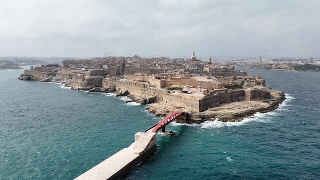 fort st elmo aerial view red breakwater bridge valletta malta overcast sky rough sea grand harbour coastal fortification peninsula star fort layout internationally recognized heritage site
