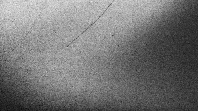 Abstract black and white grainy texture featuring a soft bright elongated streak and scattered speckles, ideal as a photography background, design asset, or creative texture