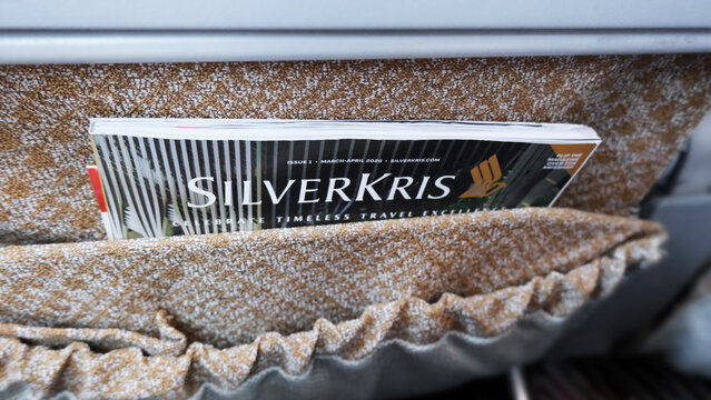 Singapore on 16 April 2026: the SilverKris magazine from Singapore Airlines tucked into the passenger seat pocket, instantly highlighting the airline's premium travel service. airline's exclusive maga
