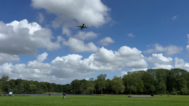 Aircraft flying over Amsterdam Forest park near Schiphol Airport, Netherlands Aircraft flying over Amsterdam Forest