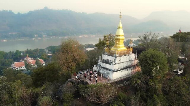 Aerial View of Wat Chom Si Stupa Overlooking the Mekong River at Sunrise, Luang Prabang, Laos