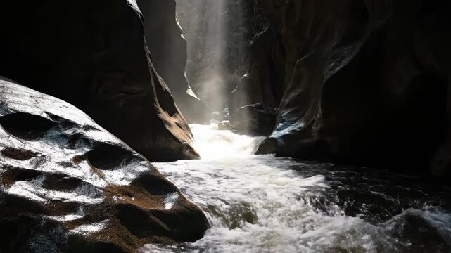 Canyon River Flowing through Narrow Gorge with Dramatic Sunbeams and Misty Spray Background