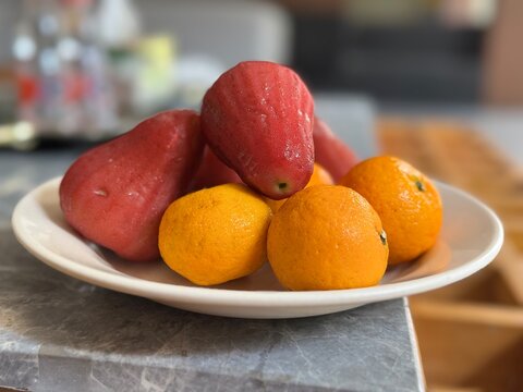 Fresh Tropical Red Water Apples and Small Mandarin Oranges