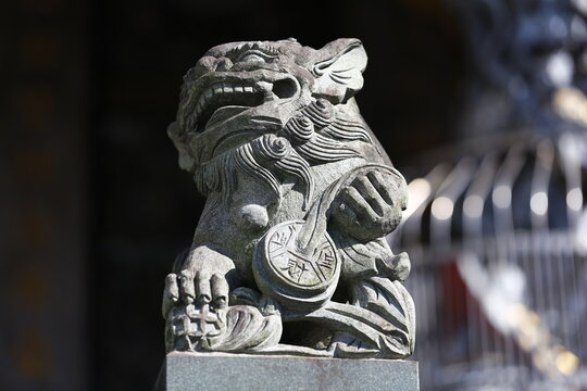 Stone Guardian Beast Holds a Coin at Temple.Stone Guardian Beast Holds a Coin at Temple.