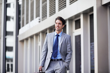 Fototapeta premium Businessman, walking and smile with decision in city, reflection and planning for urban development. Outdoor, town planner and happy person with job opportunity, travel or contemplating career choice