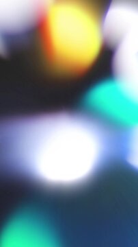 Vertical Abstract background with colorful blurred light bokeh circles