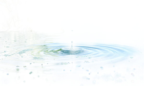 Water drop ripples falling into a calm surface creating circular waves cut out on a transparent background