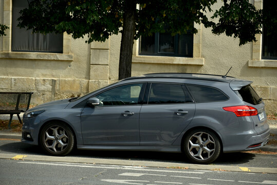 St- Amand Montrond - France - 5 August 2026 - Editorial photograph of a grey Ford Focus Estate parked on a city street in France, showing the side profile of the compact family station wagon.