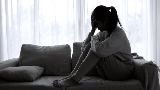 Woman suffering from depression and crying alone, representing mental health struggles, family problems, emotional abuse, stress, trauma, loneliness, and recovery.
