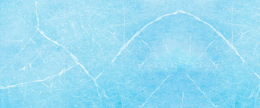 Light blue textured ice surface background with cracks and scratches