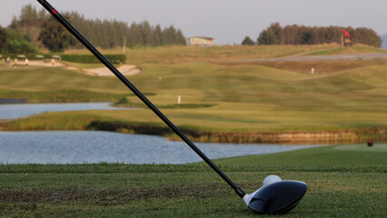 Fototapeta premium Close Up of Golf Driver Behind Ball on Tee Box