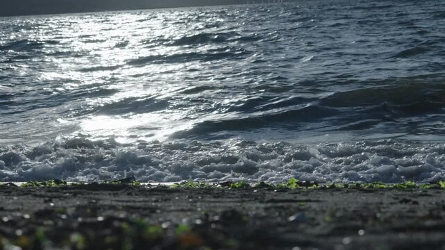 Ocean waves hitting the shore in slow motion