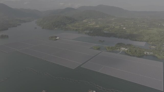 Aerial drone view of floating solar farm on Da Mi hydropower reservoir in Ham Thuan Bac, Binh Thuan, , Lam Dong, Vietnam. D log mode