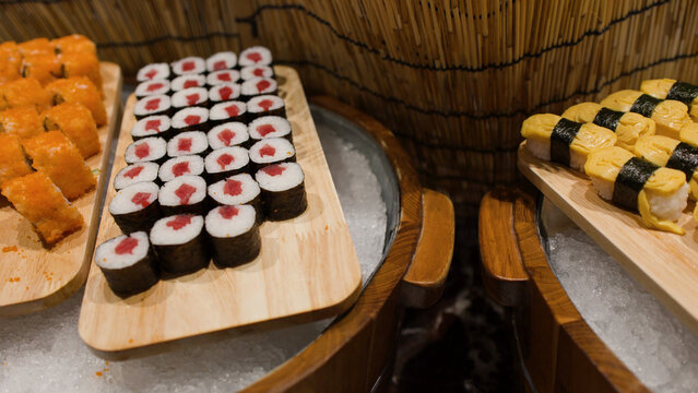 Assorted Japanese Sushi Maki and Tamago Nigiri on Ice Buffet Display