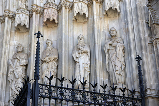 Gothic figures of saints on the arch of the entrance portal on the facade of Barcelona Cathedral &ndash; Metropolitan Cathedral Basilica of the Holy Cross and Saint