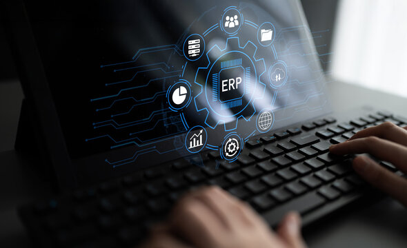 Hands Typing on Keyboard with Digital ERP Interface Displayed on a Laptop Screen, Illustration of Business Efficiency and Technological Innovation. Entropy.