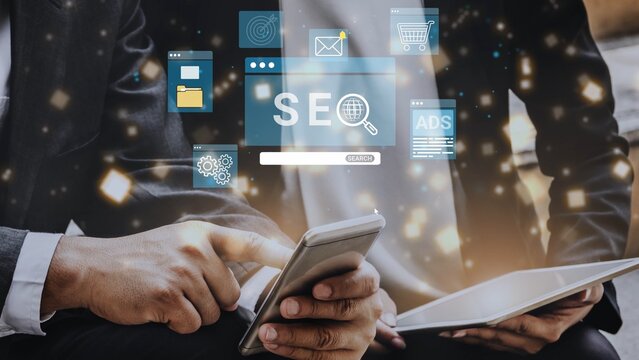 Business people using smartphone and tablet with SEO and digital marketing icons around them in a modern office setting. Entropy.