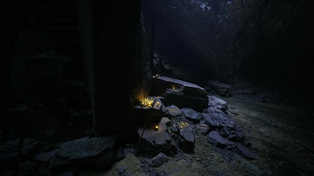 Clustered candles along stone steps, votive lights surrounding weathered pillar, warm amber pools, textured limestone, contemplative sanctuary mood
