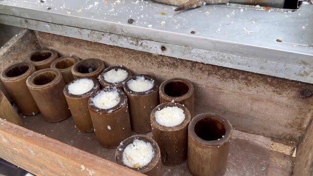 Traditional Indonesian Putu Cake Steaming inside Wooden Bamboo Molds