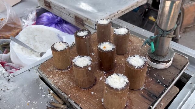 Traditional Indonesian putu cake steamed in bamboo tubes