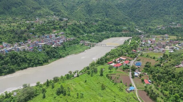 Rural hillside settlements divided by wide river valley aerial