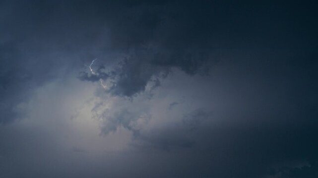 Slow Motion Lightning Strike Against Clouds