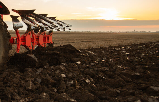 Agricultural works at farmlands, agriculture tractor-closeup