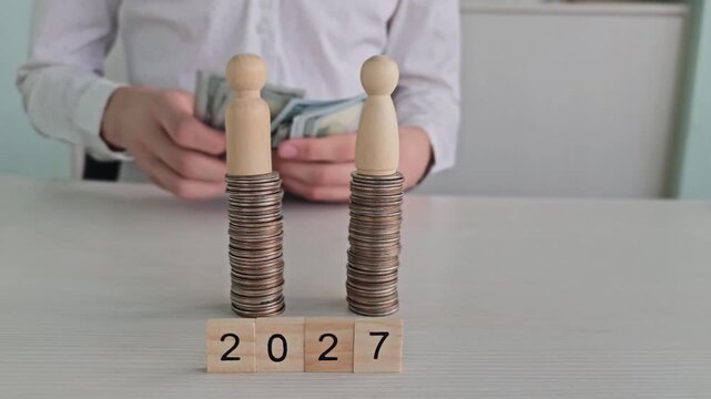 Storing coins and bills for future use in a simple setup showing years on a table